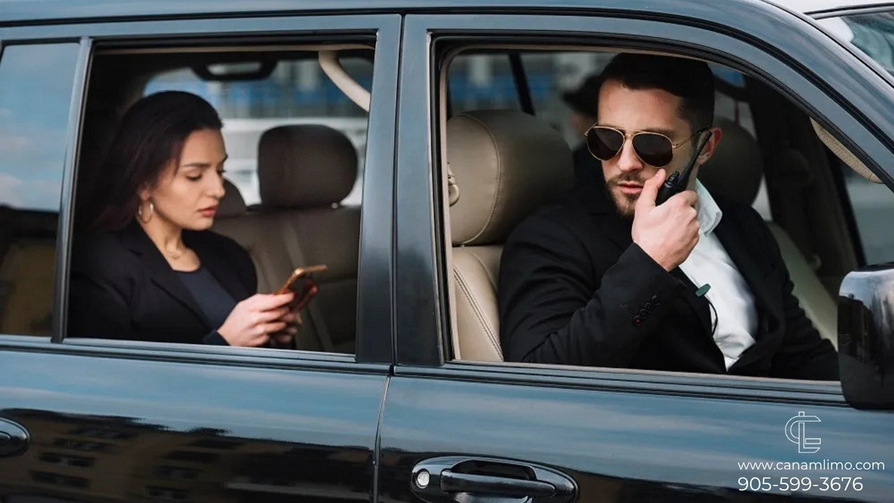 Businesswoman in luxury executive limo with professional chauffeur using two-way radio, representing premium corporate transportation.